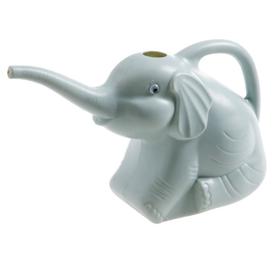 Baby elephant watering flowers
